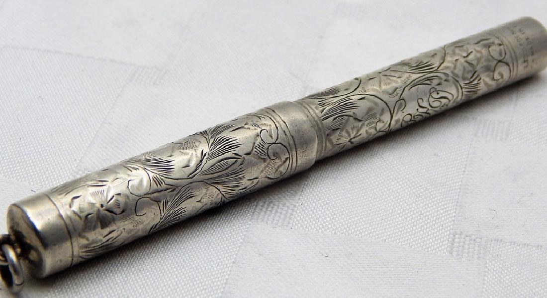 Victorian Sterling Silver Fountain Pen: Heavily engraved with floral and other designs. Makers marks are worn hard to read. Circa 1880 - 1920.
