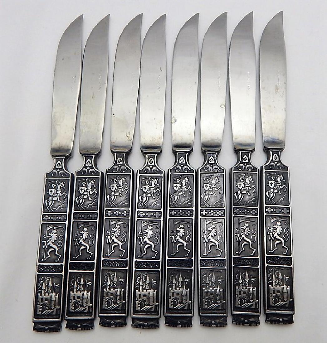 8 Gothic Medieval Design Steak Knives: Crusader pattern with knight on horse, lion with banner, and castle scenes on handle. Very heavy, sharp with good detail in stainless steel. Marked "Nasco Japan". Estimate $75 - $125 Starting Bid $30