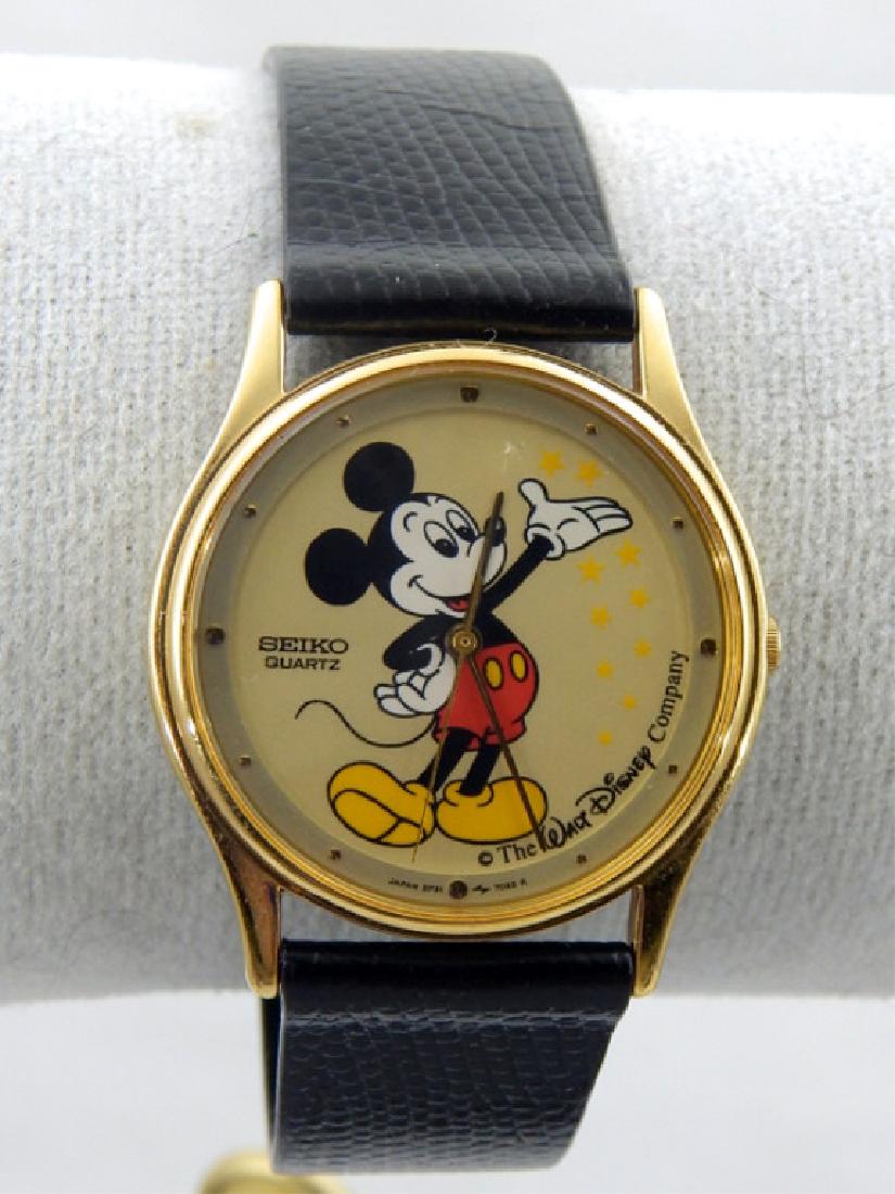 Vintage Walt Disney Company Mickey Mouse Watch: Seiko watch with black calf skin band made in Canada, has original tag attached to band, never worn. Circa 1940s - 50s. Estimate $100 - $150 Starting Bid $20