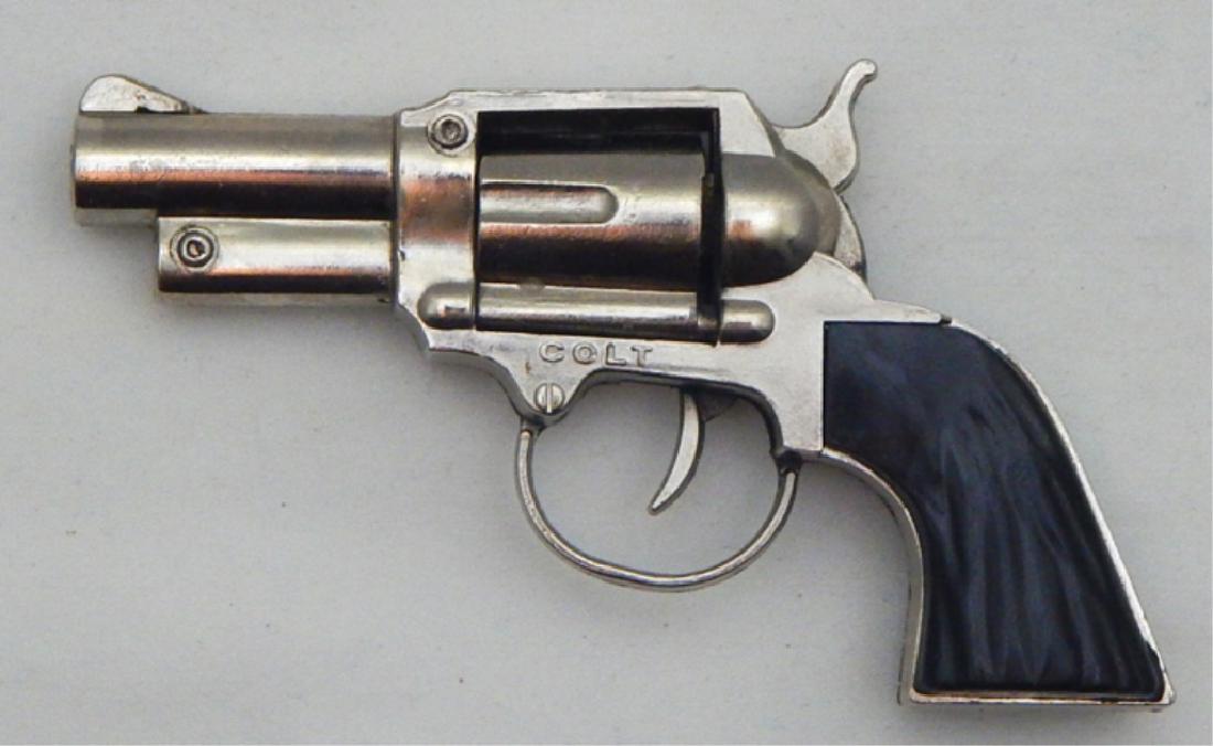 Vintage Colt Salesman Sample Cap Gun: Measures 2 1/4" x 4". Estimate $50 - $100 Starting Bid $20