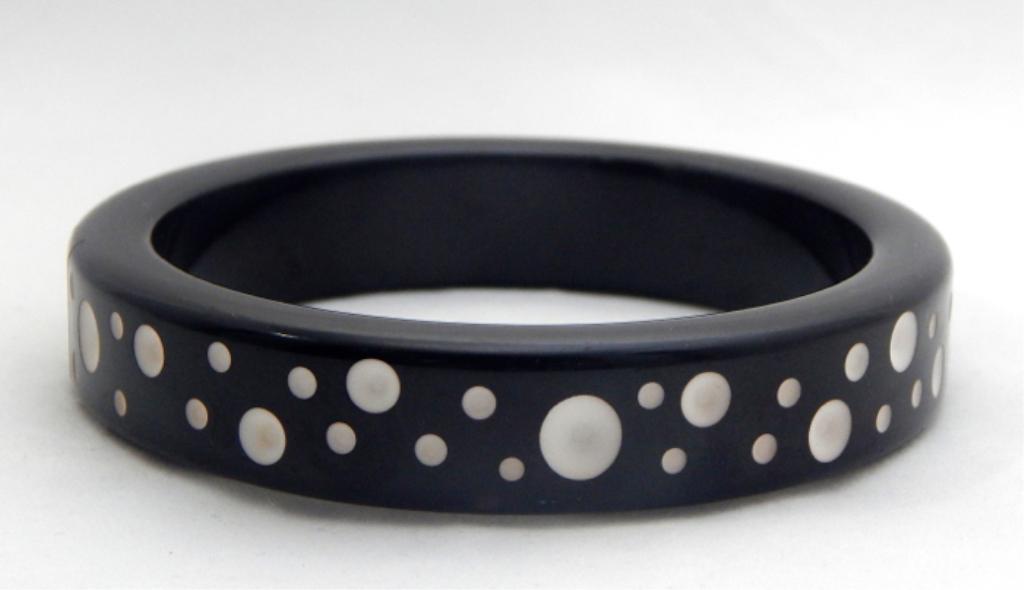 Vintage Rare Polka Dot Black Bakelite Bangle: Polka dots and stripes. Estimate $200 - $300 Starting Bid $20