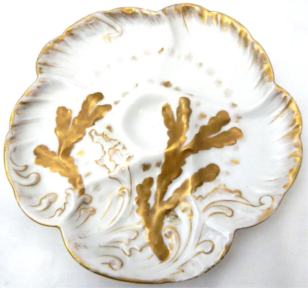 French Haviland Limoges Oyster Plate, c1880: Hand painted in heavy gold on white, five oyster wells and one sauce well, scalloped edge. Marked "CFH/GDM" for Charles Field Haviland and Gerard, Duralsseix and Morel. Great condition. Measures 8 1/2