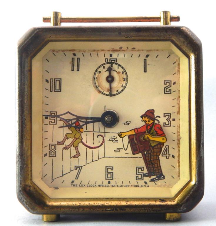 Lux Clock Mfg. Co. Automaton Clock (as is): Painted metal clock. Large hands and second hands move but not sure if working, paint loss. Measures 4 1/2" x 4". Estimate $30 - $50 Starting Bid $10