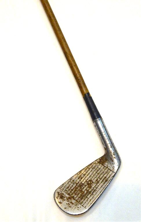 "Spalding Tournament Model" 4-Iron Golf Club: Wooden shaft and leather handle. Estimate $100 - $150 Starting Bid $20