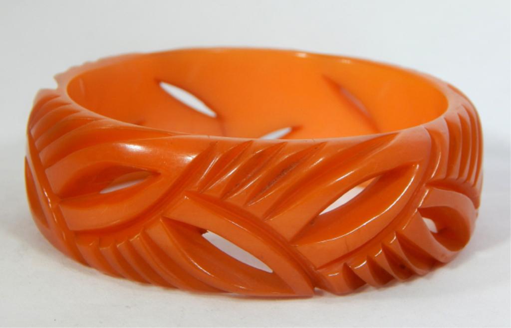 Vintage Carved Orange Bakelite Bangle: Estimate $200 - $300 Starting Bid $20