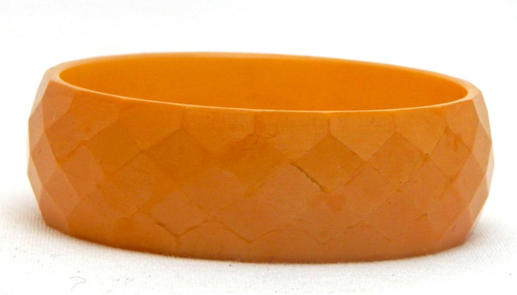 Vintage Carved Butterscotch Bakelite Bangle: Checkerboard pattern. Estimate $200 - $300 Starting Bid $20