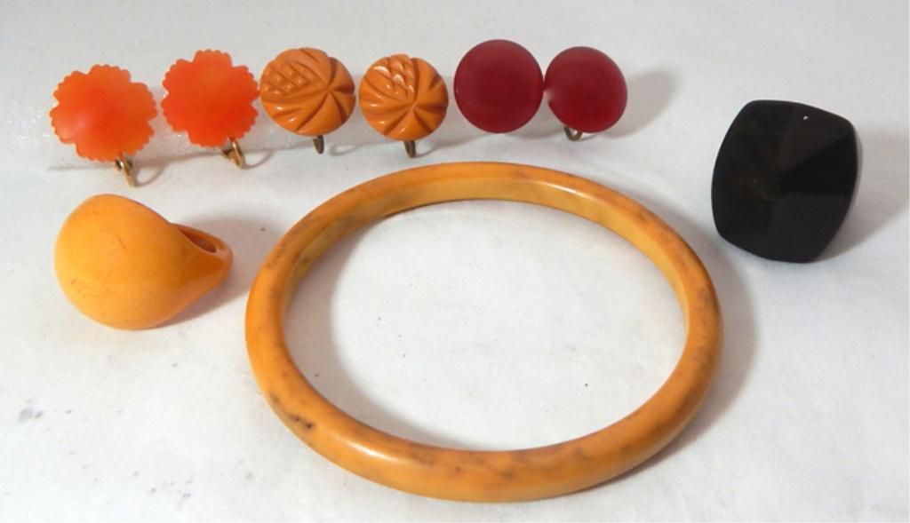 Vintage Bakelite Earrings, Bracelet and Rings: Includes carved orange earrings, carved butterscotch earrings, red earrings, butterscotch bangle, butterscotch ring and black ring. Estimate $200 - $300 Starting Bid $20