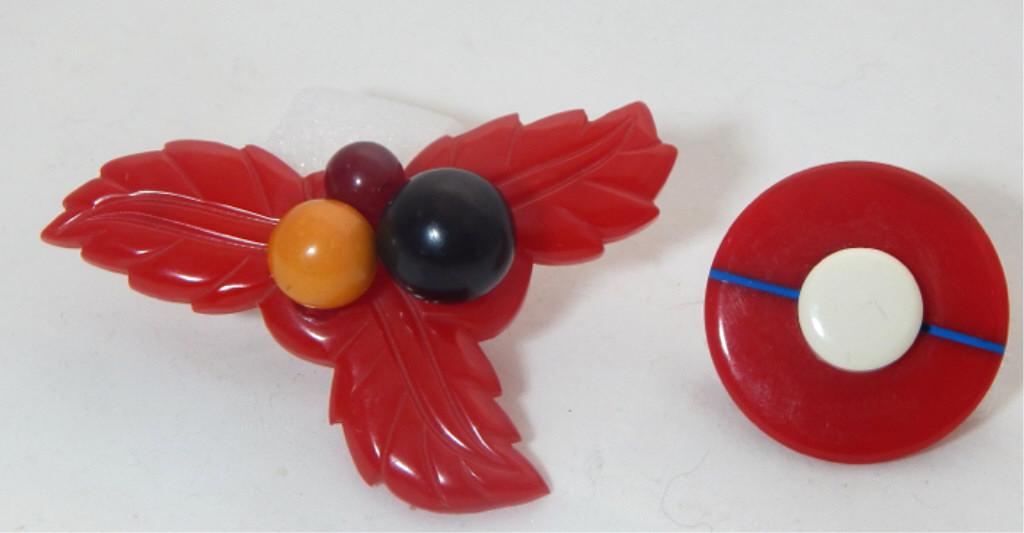 2 Vintage Carved Bakelite Brooches: Measures 1 3/4" x 3" and 1 1/2" diameter. Marked "Made in France". Estimate $200 - $300 Starting Bid $20