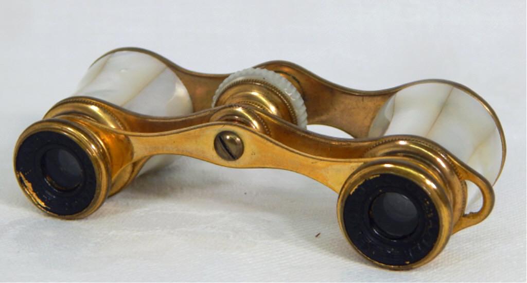 French Chevalier Optiem Opera Glasses: Brass and mother of pearl. Marked "Chevalier Optiem". Measures 1 3/4" x 3 1/2". Estimate $40 - $80 Starting Bid $10