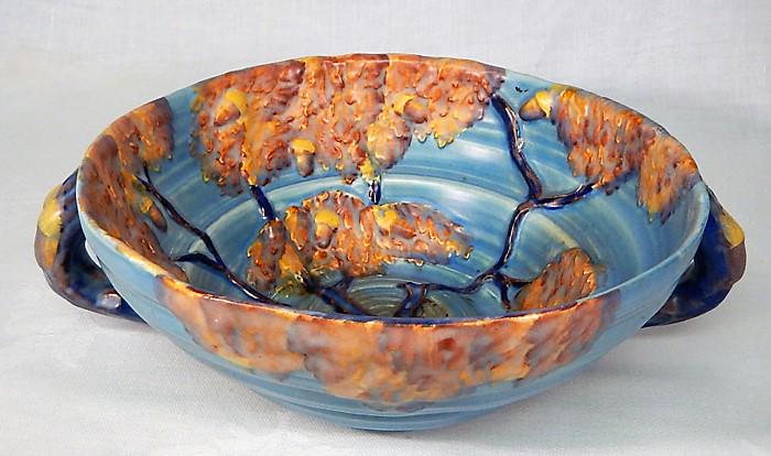 Carlton Ware "Night Oak" Pottery Serving Bowl: Blue Night Oak Tree pattern serving bowl with double handles. Made in England, c1930s. Makers mark and incised number. Measures 3 1/4" x 10 1/2". Estimate $100 - $150 Starting Bid $20