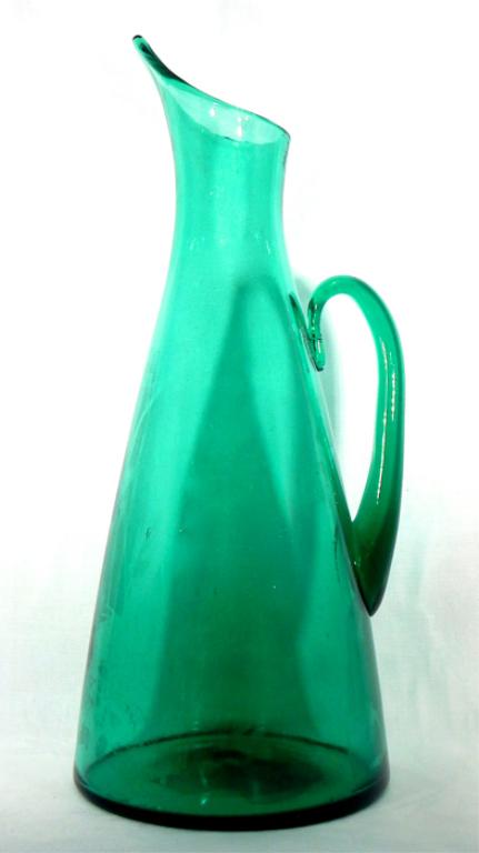 Huge Blenko Art Glass Vase By Winslow Anderson: Large hand blown green art glass pitcher vase by Winslow Anderson #976 designed for Blenko, circa early 1950s. Polished pontil. Measures 17 1/2" x 7". Estimate $200 - $300 Starting Bid $20