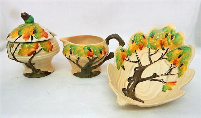 Carlton Ware "Day Oak" Pottery Cream, Sugar & Dish: Day Oak Tree pattern cream 3" x 5", sugar 5" x 4", and dish 8" x 5". Made in England, c1930s. Makers mark and incised number. Estimate $100 - $150 Starting Bid $20