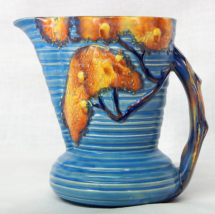 Carlton Ware "Night Oak" Pottery Pitcher: Blue Night Oak Tree pattern large cream or pitcher with handle. Made in England, c1930s. Makers mark and incised number. Measures 5 1/2" x 5 1/2". Estimate $100 - $150 Starting Bid $20