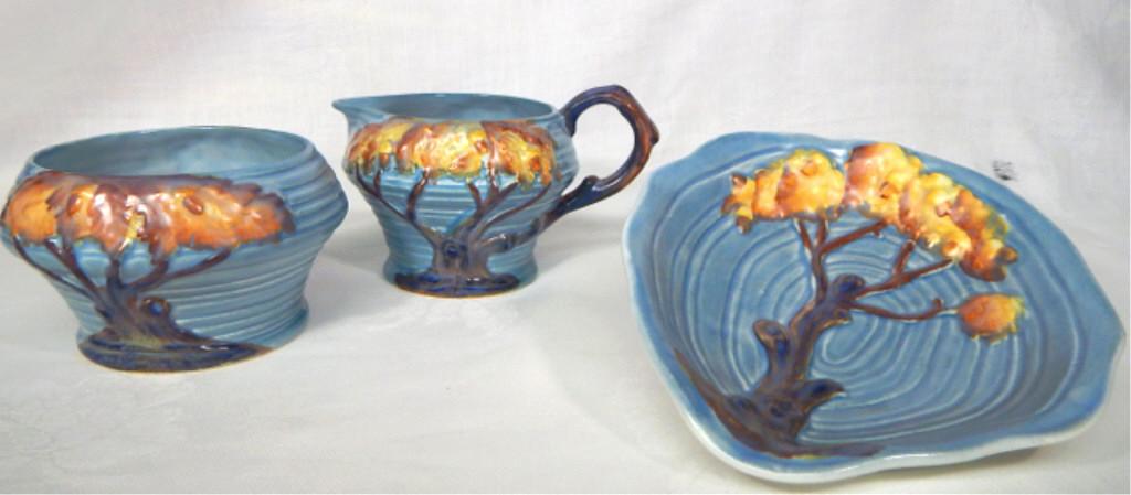 Carlton Ware "Night Oak" Pottery, 3 pieces: Blue Night Oak Tree pattern cream 2 1/2" x 4", sugar 3" x 5", and dish 5 1/2" x 6 1/2". Made in England, c1930s. Makers mark and incised number. Estimate $100 - $150 Starting Bid $20