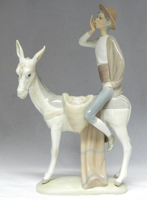 Rare Lladro "Honey Peddler" Boy on Donkey, Retired: Boy sitting on donkey with honey jars. Issued in 1970 By Juan Huerta, retired in 1981. Lladro mark on bottom. Great condition. Measures 11 1/2" x 7 1/2". Estimate $100 - $150 Starting Bid $20