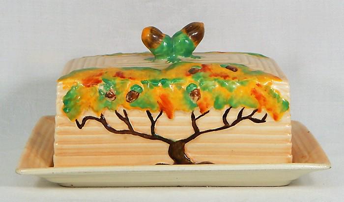 Carlton Ware "Day Oak" Pottery Lg Covered Butter: Day Oak Tree pattern large covered butter dish. Made in England, c1930s. Makers mark and incised number. Measures 3 1/2" x 7" x 5". Estimate $100 - $150 Starting Bid $20