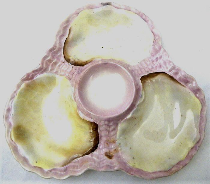 Rare Pink and White Lady's Oyster Plate, c1880: Three oyster wells and one sauce well, unmarked. Measures 7 1/2". Great condition. Estimate $50 - $100 Starting Bid $20