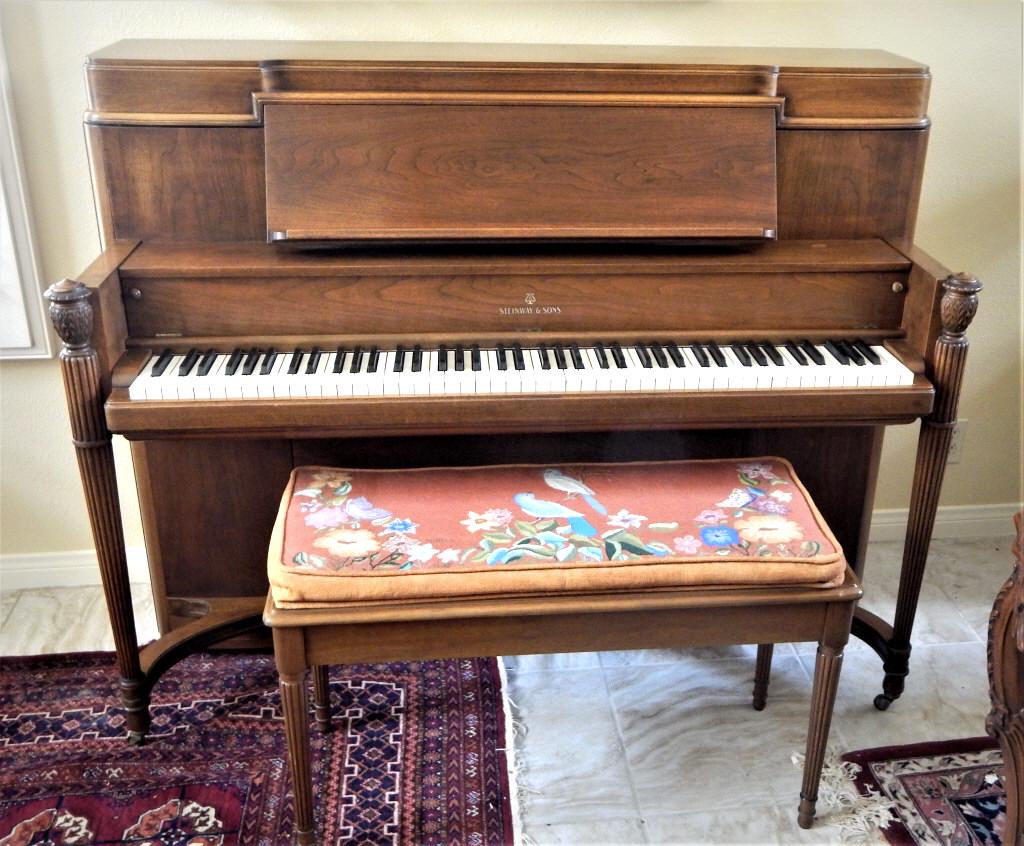 Rare Walnut Steinway Piano with Bench: Accelerated Action Diaphragmatic Soundboard, Numbered 345432 and J761. Measures 45" x 57" x 25". Estimate $2,500 - $4,000 Starting Bid $500