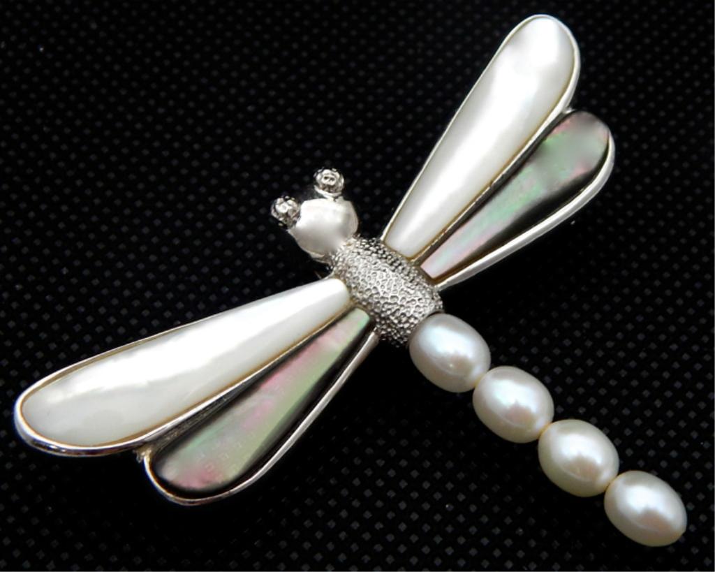 Sterling & Pearl Dragonfly Pendant Brooch: Mother of pearl and abalone wings with cultured pearls on tail set in sterling silver. Marked "sterling" and artist signed "VAR". Measures 2" x 2 1/2". Total weight 13.4 grams. Estimate $150 - $200 St