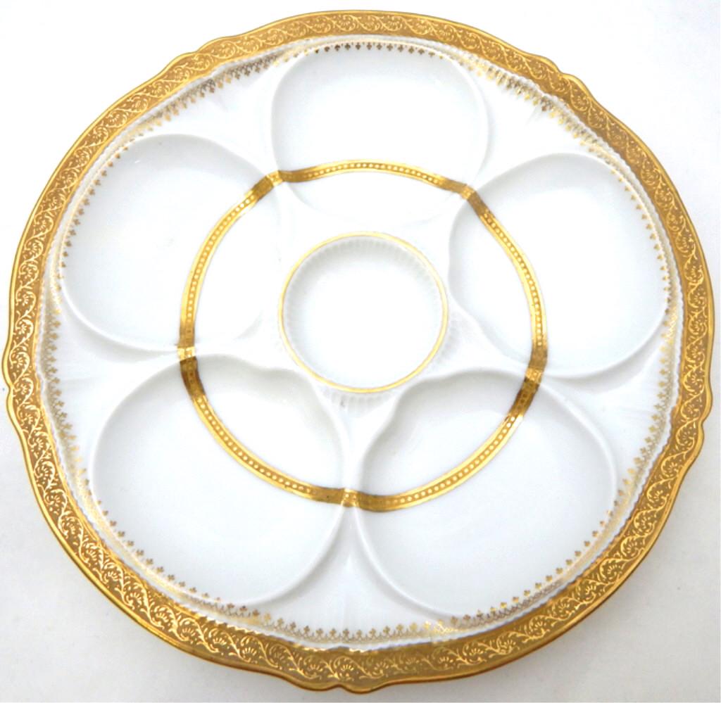 Theodore Haviland Limoges Oyster Plate, c1890: Hand painted in heavy gold design, with five oyster wells and one sauce well. Measures 9". Marked "Shreve & Company San Francisco, California" also marked "Theodore Haviland Limoges France Patent Appl