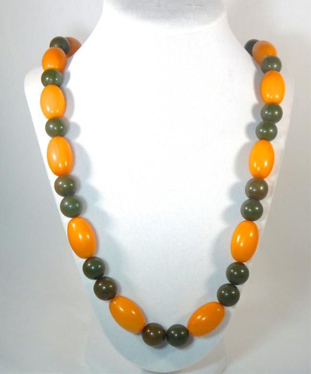 Vintage Butterscotch & Green Bakelite Bead Necklac: Measures 14". Estimate $100 - $200 Starting Bid $20