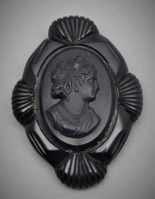 Vintage Black Bakelite Cameo Brooch: Measures 3" x 2". Estimate $50 - $100 Starting Bid $10
