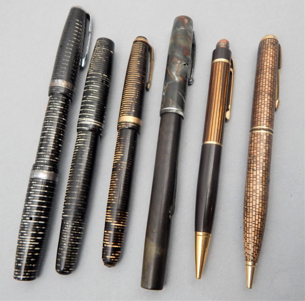 Group of 6 Striped Design Pens / Pencils: Including 2 Parker with 14k nibs, Eversharp with 14k nib, Parker pencil with brick wall design, Eversharp striped pencil, and Waterman 14k nib green and brown marble pattern. Estimate $50 - $100 Start
