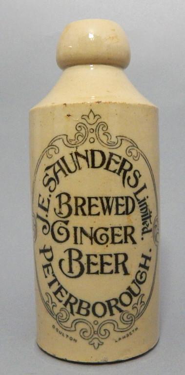 Old Doulton Lambeth Stoneware Beer Bottle: "J.E. Saunders Limited Peterborough Brewed Ginger Beer" by Diane Alexander Collection with incised Doulton Lambeth mark. Measures 7". Tiny chip on inside rim. Estimate $50 - $100 Starting Bid $20