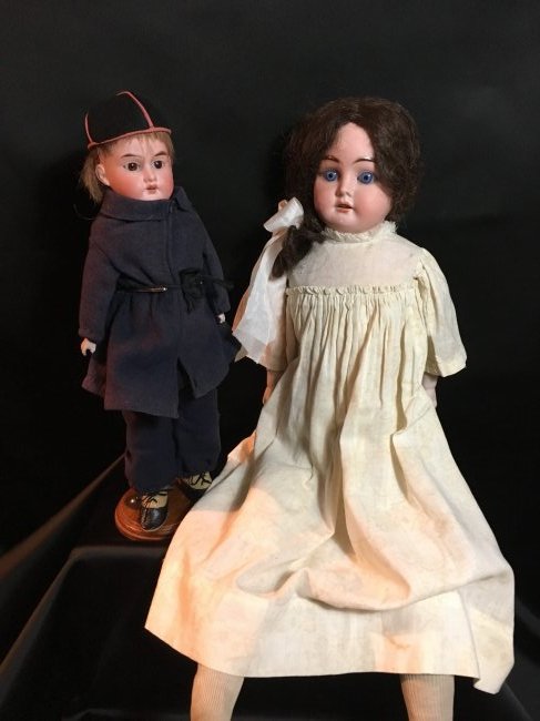 Lot of 2 Antique Bisque Shoulder Heads: 22" Ernst Heubach shoulderhead, incised with horseshoe/1902/0 1/2. Blue set eyes, antique brunette wig is coarse, open mouth with teeth. No damages to bisque. Body is rough, made of muslin, kid leathe