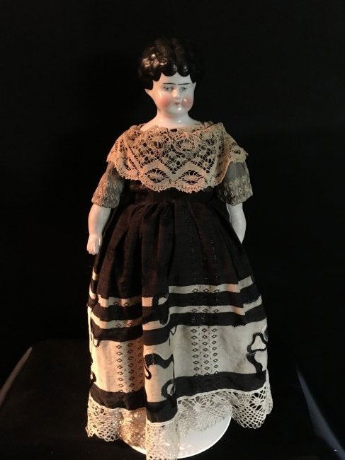 1890's Antique Low Brow China Head: 12" unmarked antique low brow china head. Dates to the 1890's, original body with china lower legs and painted boots. Unglazed china hands. Shine is worn from back of hair, no breaks or chips to shoul