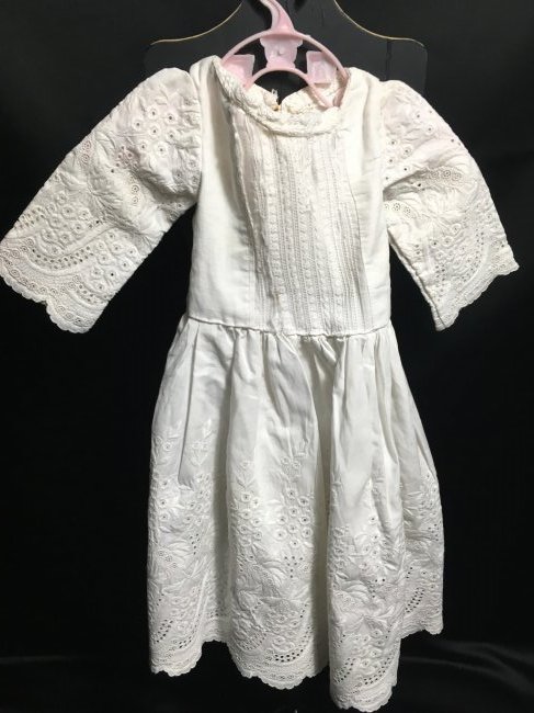 Antique/Vintage Doll Dress.. Elaborate Skirt: Beautiful elaborate skirt on this sweet antique/vintage doll dress. The sleeves match the skirt. The front of the bodice has some tearing. 17" long and 6" across waist. Sleeves are 6 1/2" long. No sna