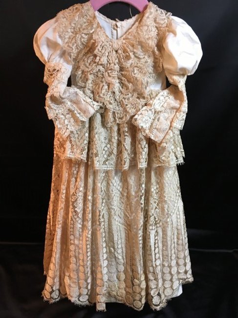 Stunning Antique/Vintage Silk & Lace Dress: Gorgeous layers of silk & lace make up this antique/vintage dress for dolls 29-32". Some tearing to lace on back collar and a stain on front of dress,bottom, Bodice is silk. Minor imperfections. 25" l