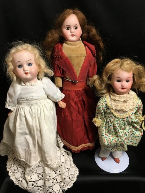 Lot of 3 Antique German Bisque Head Dolls: 3 nice antique German bisque head dolls. 9" doll incised 200-14/0/WALTHER & SOHN INSIGNIA/GERMANY. Brown glass set eyes, open mouth with teeth, dimpled chin. Blonde human hair wig. Torso is made of pa