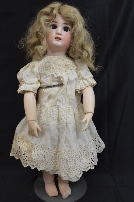 Rare Antique German Franz Schmidt Doll 24": Antique bisque socket head doll attributed to Franz Schmidt. Stands 24" tall. Flawless bisque, dark blue sleep eyes, open mouth showing 6 teeth. Incised 17 with the anvil mark of Franz Schmidt & Co. M