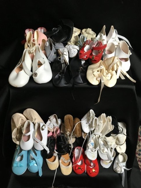 Lot of 30 Pairs of Vintage Doll Shoes.: 30 pairs of vintage doll shoes. Most are new. Various colors, sizes and styles. Largest pair is 3 1/2" long x 1 5/8" wide and the smallest is 1 3/4" x 7/8" long. Some may have small imperfections. Shi