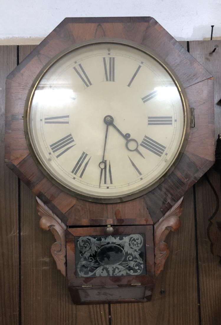 Antique Wall clock in need of repair: larger sizesd wall clock in need of repair. Broken in multiple spots and glass has cracks as well as wood in need of refininishing. 24" H