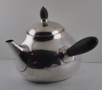 Georg Jensen Sterling Silver Coffee Pot: A Danish Sterling Silver Coffee Pot, Georg Jensen Silversmith , Copenhagen of ovoid form with rosewood handle at right angle to spout, wood finial and handle with applied beading at joint base with Je