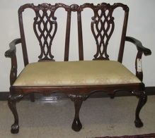 A PAIR OF CHIPPENDALE STYLE MAHOGANY DOUBLE CHAI: A PAIR OF CHIPPENDALE STYLE MAHOGANY DOUBLE CHAIR-BACK SETTEES, with matching drop-in cushion seats over cabriole legs with carved ball-and-claw feet. Dimensions: 41.25"H x 44"L. MATCHES PRECEDING.