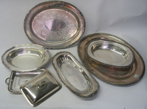A GROUP OF SEVEN SILVERPLATED TABLE ACCESSORIES, i: A GROUP OF SEVEN SILVERPLATED TABLE ACCESSORIES, including a covered butter dish; a relish tray; covered rectangular vegetable bowl; two open vegetable bowls; together with two serving trays. By assor