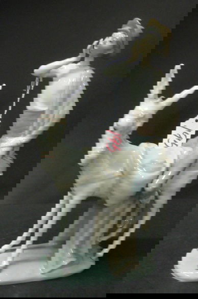 A LLADRO GLAZED PORCELAIN FIGURE, of a young man r: A LLADRO GLAZED PORCELAIN FIGURE, of a young man riding a donkey, marked with the Lladro blue trademark underfoot. Height 11-1/4 in.