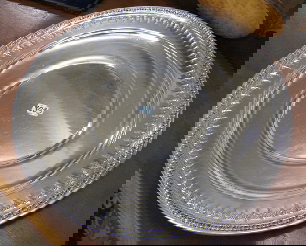 THREE SILVERPLATED TABLE ACCESSORIES: an English: THREE SILVERPLATED TABLE ACCESSORIES: an English style two-piece fish set in original velvet lined storage case. The engraved knife with the Silversmith's trademark, R&B (Reed & Barton). Included is a