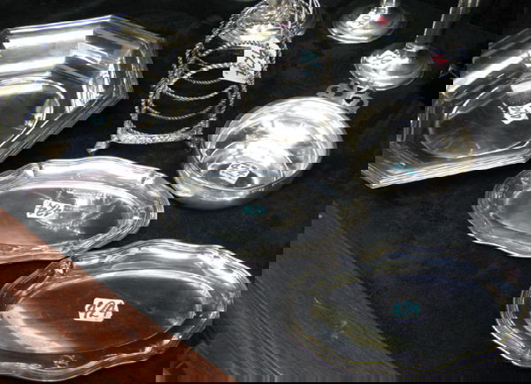 A GROUP OF FOUR CONTINENTAL SILVER AND PLATED TAB: A GROUP OF FOUR CONTINENTAL SILVER AND PLATED TABLE ACCESSORIES. Included is a six-sided bowl, rimmed border, marked .835; a porringer marked Sterling; two oval salvers, 7 in. by 4-1/4 in., marked .80