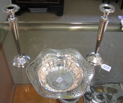 THREE AMERICAN STERLING SILVER TABLE ACCESSORIES.: THREE AMERICAN STERLING SILVER TABLE ACCESSORIES. One is a pierced center bowl with beaded and ruffled rim, marked with the Whiting Silver Co. trademark underfoot, 9-1/2 in. ht.; plus a pair of tapere