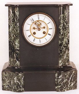 AN AMERICAN MARBLE MANTLE CLOCK, the curved front w