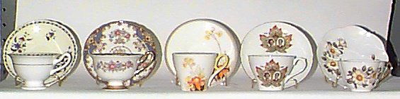 FIVE SHELLEY CHINA TEA CUPS AND SAUCER SETS, includ: FIVE SHELLEY CHINA TEA CUPS AND SAUCER SETS, including; Royal Commemorative 1959, white rose, "Sheraton", Jonquil, and other floral design. All signed under bases.