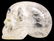 806: A NATURAL ROCK CRYSTAL SCULPTURE of a human skull.