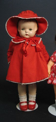 AN ALL COMPOSITION PATSY ANN DOLL, by Effanbee Dol: AN ALL COMPOSITION PATSY ANN DOLL, by Effanbee Doll Co., New York. The girl doll with molded red hair, sleep eyes, bent right arm, cotton dress with red coat and hat, jointed arms and legs, 18 in., ma