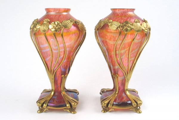 PAIR LOETZ ART GLASS VASES, bronze mounted, c. 190: PAIR LOETZ ART GLASS VASES, bronze mounted, c. 1900. Shades of reds with curved wide lines of iridescent silver-blue. Heights 11 in. Literature: similar examples in Helmut Ricke et al, "Loetz Bohmisch