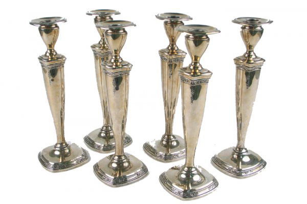 PAIR OF WALLACE STERLING SILVER CANDLESTICKS, hand: PAIR OF WALLACE STERLING SILVER CANDLESTICKS, hand chased and engraved in a delicate floral pattern, 11 in. ht. Marked with the Silversmith's trademark, Wallace (Silversmiths), Sterling underfoot. (Ma