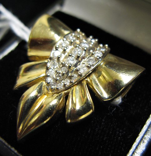 DIAMOND AND FOURTEEN KARAT GOLD PENDANT, set with